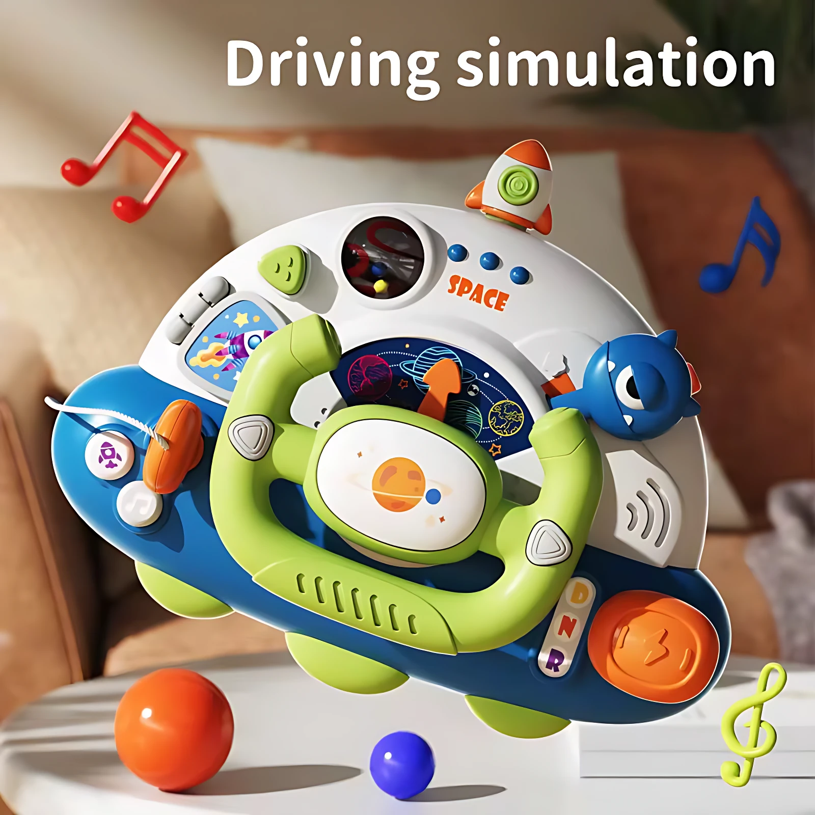 Volante de simulación espacial en azul y verde con palanca, luces y botones; incluye bolas de colores y accesorios temáticos para juego interactivo.