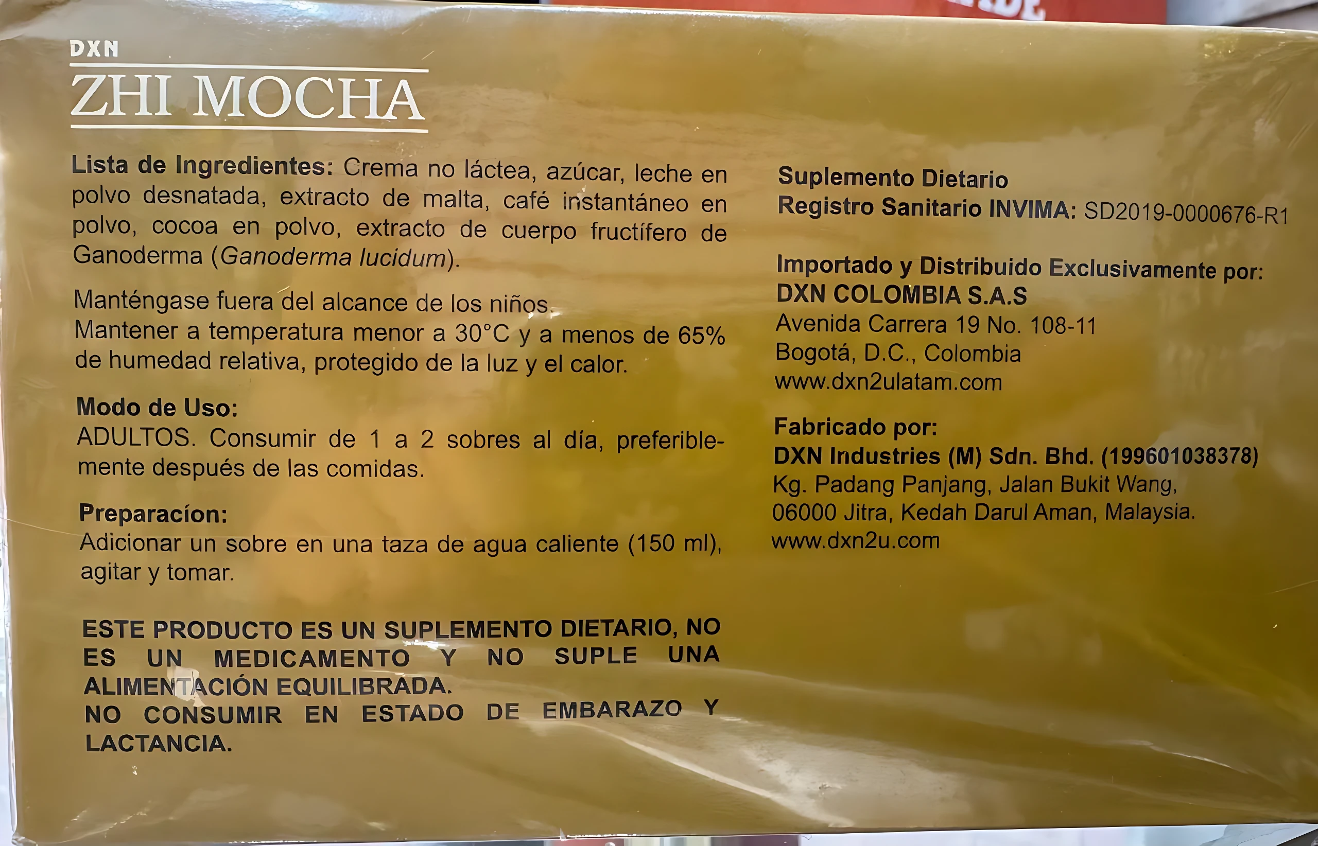 Etiqueta ALT: Sobre individual de suplemento dietario Zhi Mocha con Ganoderma y cacao, color beige con texto negro, incluye lista de ingredientes, modo de uso y advertencias sanitarias.