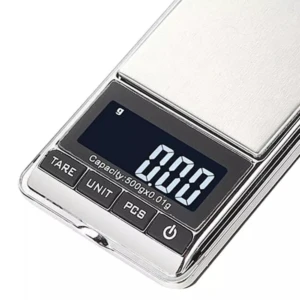 Báscula digital de acero inoxidable con pantalla LCD mostrando 0.00 g, capacidad 500 g x 0.01 g, botones TARE, UNIT, PCS y encendido.