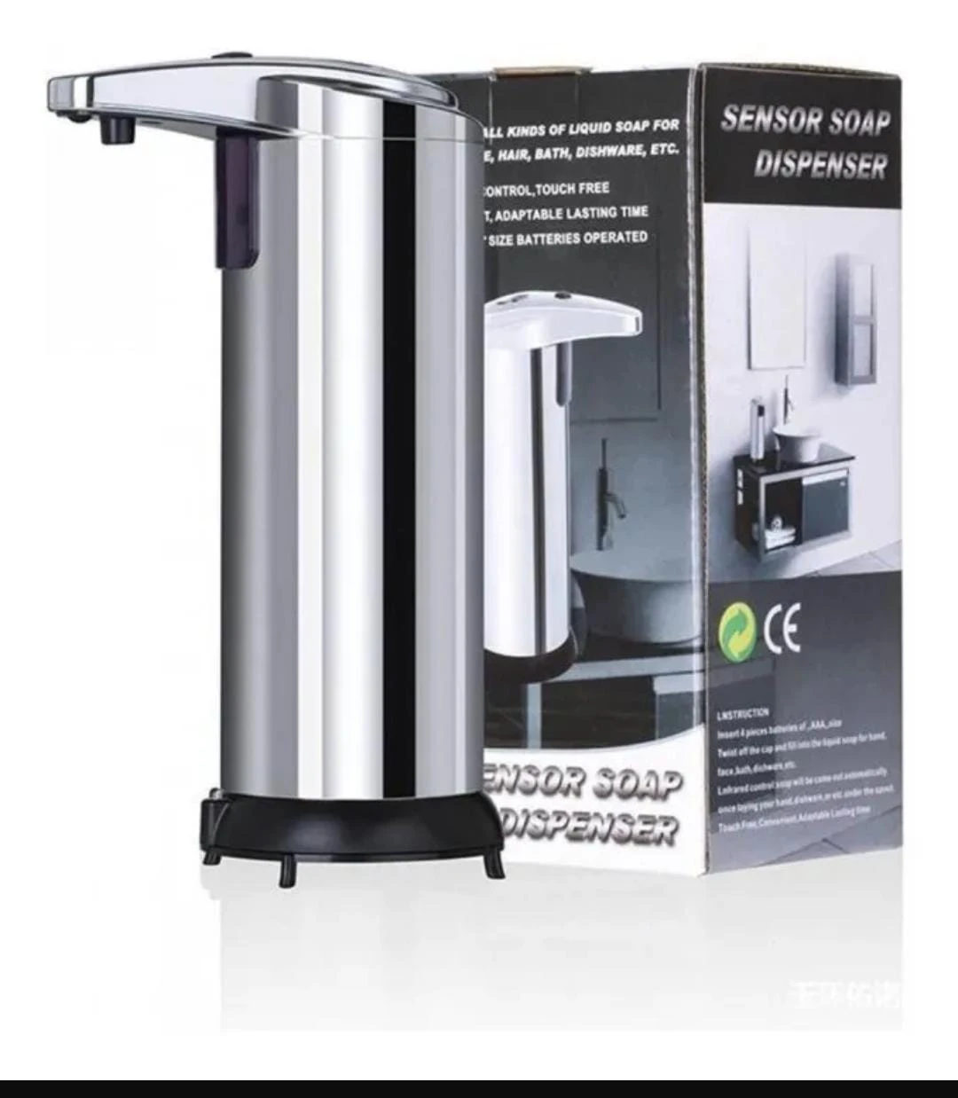 Dispensador automático de jabón en acero inoxidable con sensor infrarrojo, base negra y empaque visible al fondo.
