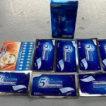 Set de dos cajas de cinta blanqueadora 5D con seis sobres individuales, presentados sobre superficie gris clara.