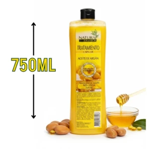 Botella de 750 ml de tratamiento capilar con aceite de argán y keratina, color amarillo, junto a nueces de argán, miel y gotas de aceite.