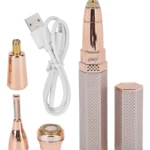 Trimer recargable en color rosa dorado con cuatro cabezales intercambiables para perfilado de cejas, barba y vello corporal, junto con cable USB y estuche protector.