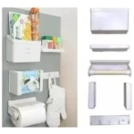 Dispensador magnético blanco de cinco piezas para nevera, con organizadores de especias, toallas y utensilios, montado en superficie gris.
