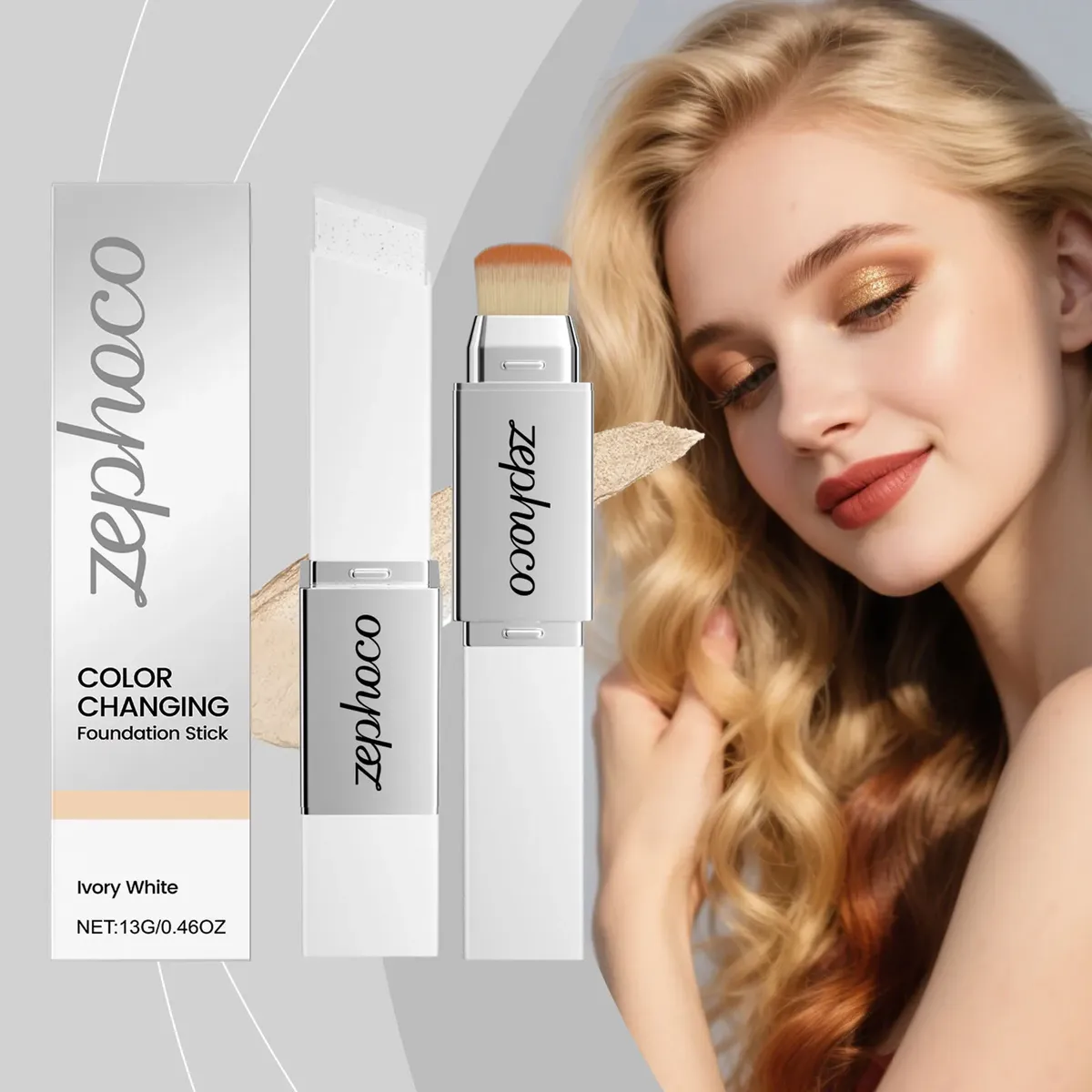 Base de maquillaje en barra Zephco color Ivory White, con aplicador de cerdas y empaque blanco, mostrando textura cremosa y acabado natural sobre piel.