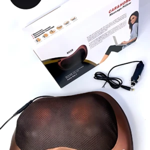 Almohada masajeador de color cobre con superficie texturizada y luces LED, junto a su caja y cable de alimentación.