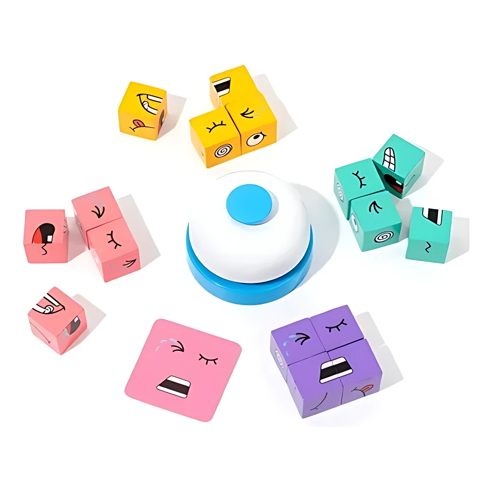 Set de dos cubos infantiles con caras expresivas en colores rosa, amarillo, turquesa y morado, dispuestos alrededor de un botón central blanco con base azul, sobre fondo blanco.