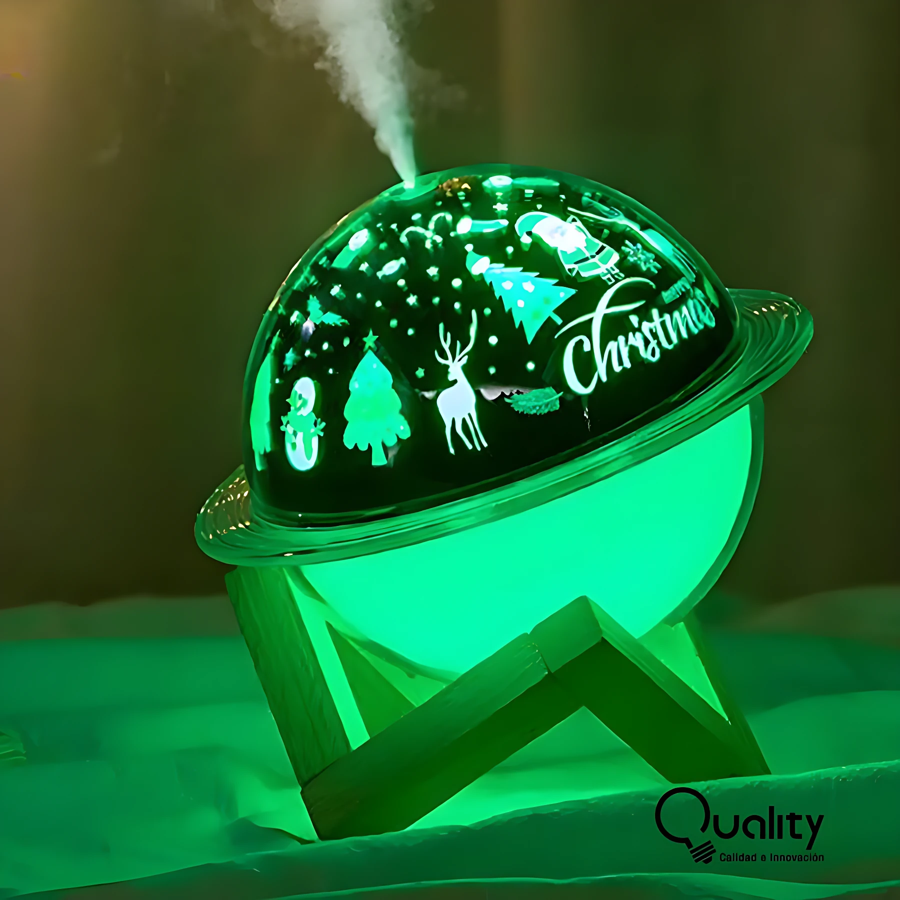 Humificador lámpara planeta 3D con proyección de luz, color verde brillante, emitiendo vapor y mostrando proyección navideña con renos, árboles y el texto “Christmas” en su superficie superior.