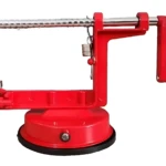Máquina manual roja para pelar y cortar frutas y verduras, con base de succión y mango ergonómico.