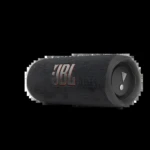 Parlante JBL Flip 6 negro con textura de rejilla, logo visible y control de volumen en extremo derecho, sobre fondo blanco.
