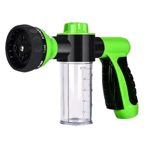 Pistola de hidrolavado verde con generador de espuma y boquilla giratoria, incluye depósito medidor de 100 ml.