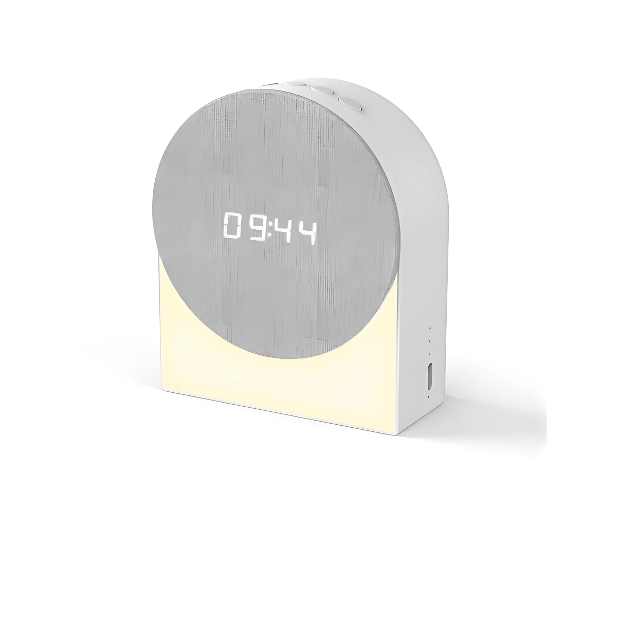Reloj despertador inteligente blanco con pantalla digital mostrando 09:44 y luz nocturna inferior encendida, diseño redondeado con textura mate.