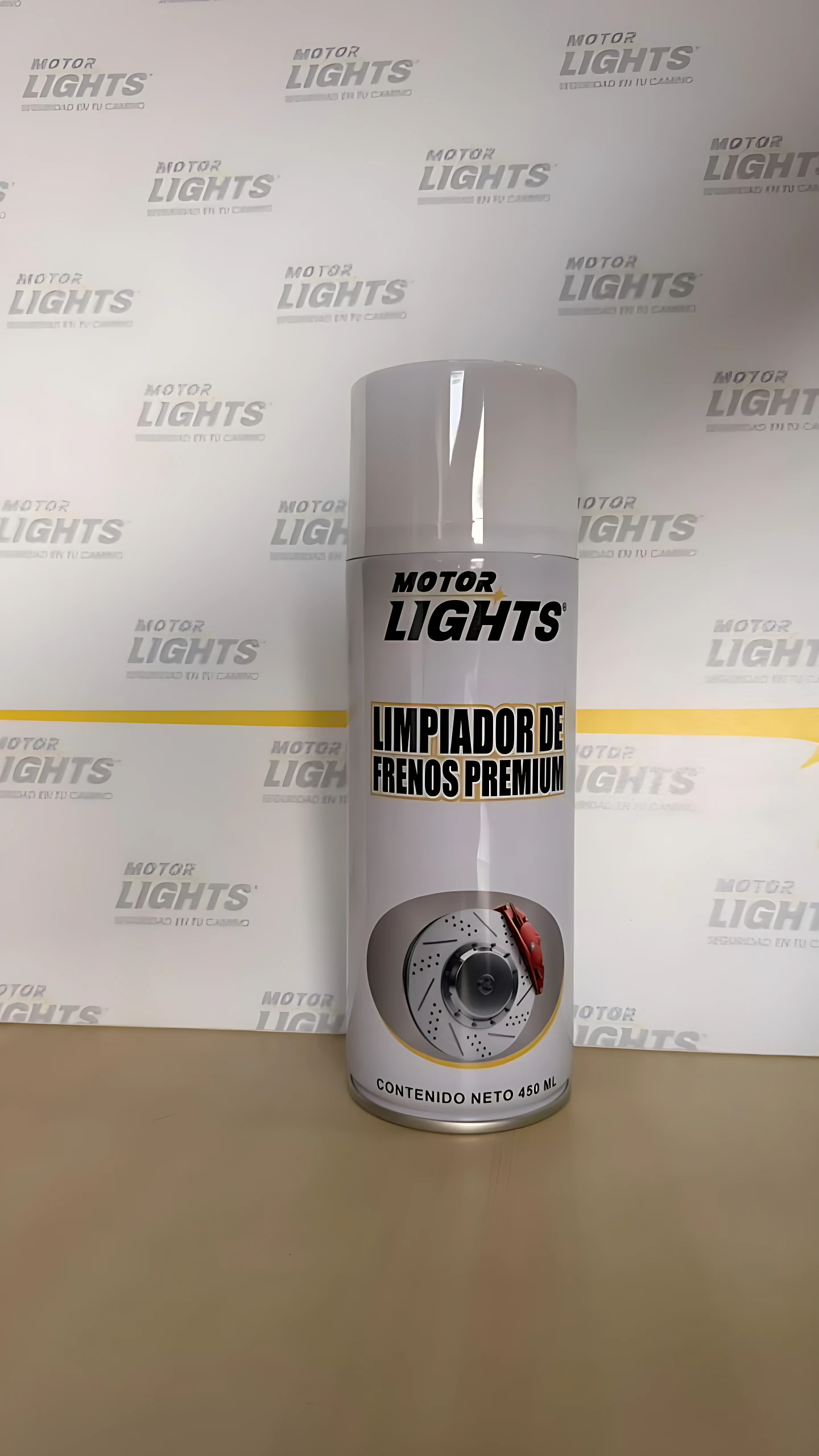 Botella de limpiador de frenos Motor Lights, presentación de 400 ml, con etiqueta blanca y diseño circular que muestra disco de freno.