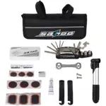Kit de herramientas para bicicleta con bolsa negra, llave multifunción, bomba de aire, parches, lubricante y accesorios organizados.