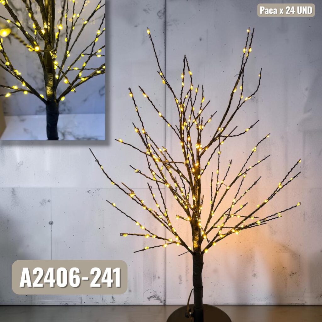 Arbusto decorativo con ramas iluminadas de luces LED cálidas junto a pared de piedra