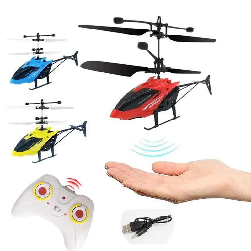 Helicóptero a control remoto rojo con sensor de movimiento, incluye control blanco, cable USB y función de vuelo sobre la mano.