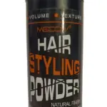 Envase cilíndrico negro de MECOW Hair Styling Powder de 5g para volumen y textura con acabado natural, etiqueta naranja y blanca.
