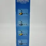 Empaque azul de helicóptero a control remoto Induction Aircraft con modelos ilustrados en colores amarillo y azul.