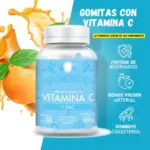 Frasco blanco de gomas masticables de Vitamina C con Zinc sabor mandarina, 180 gramos y 60 unidades, acompañado de naranjas frescas y salpicaduras.
