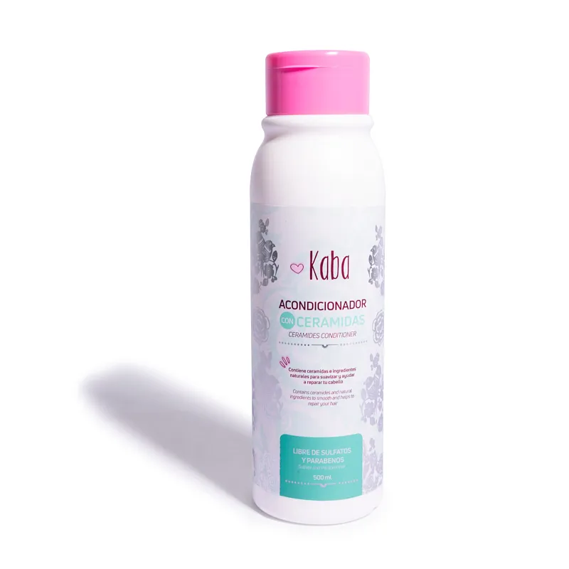 Botella cilíndrica de acondicionador Kaba de 500 ml con tapa rosada, etiqueta blanca con detalles florales grises y texto descriptivo en español e inglés.