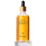 Sérum facial Bioaqua con oro 24K y ácido hialurónico en botella de vidrio transparente con gotero dorado sobre base de cristal.