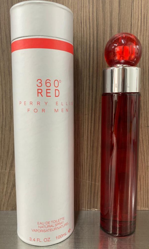 Perfume Perry Ellis 360 Red Eau de Toilette de 100 mililitros en envase cilíndrico rojo junto a su caja tubular blanca con detalles rojos.