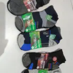 Cinco pares de medias tobilleras Othella surtidas en colores negro, gris y azul con empaques individuales, talla 10-13.