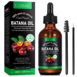 Frasco ámbar de aceite de Batana de 60 ml con gotero, caja negra con frutos de palma, cepillo para pestañas y aplicador fino.