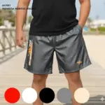 Pantaloneta cargo gris para hombre con detalles naranja y tela transpirable. Disponible en rojo, blanco, negro, gris y beige para viajes.