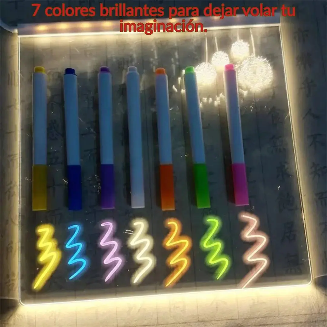 Tablero acrílico luminoso con base LED y siete marcadores de colores fluorescentes alineados, mostrando trazos brillantes sobre la superficie transparente.