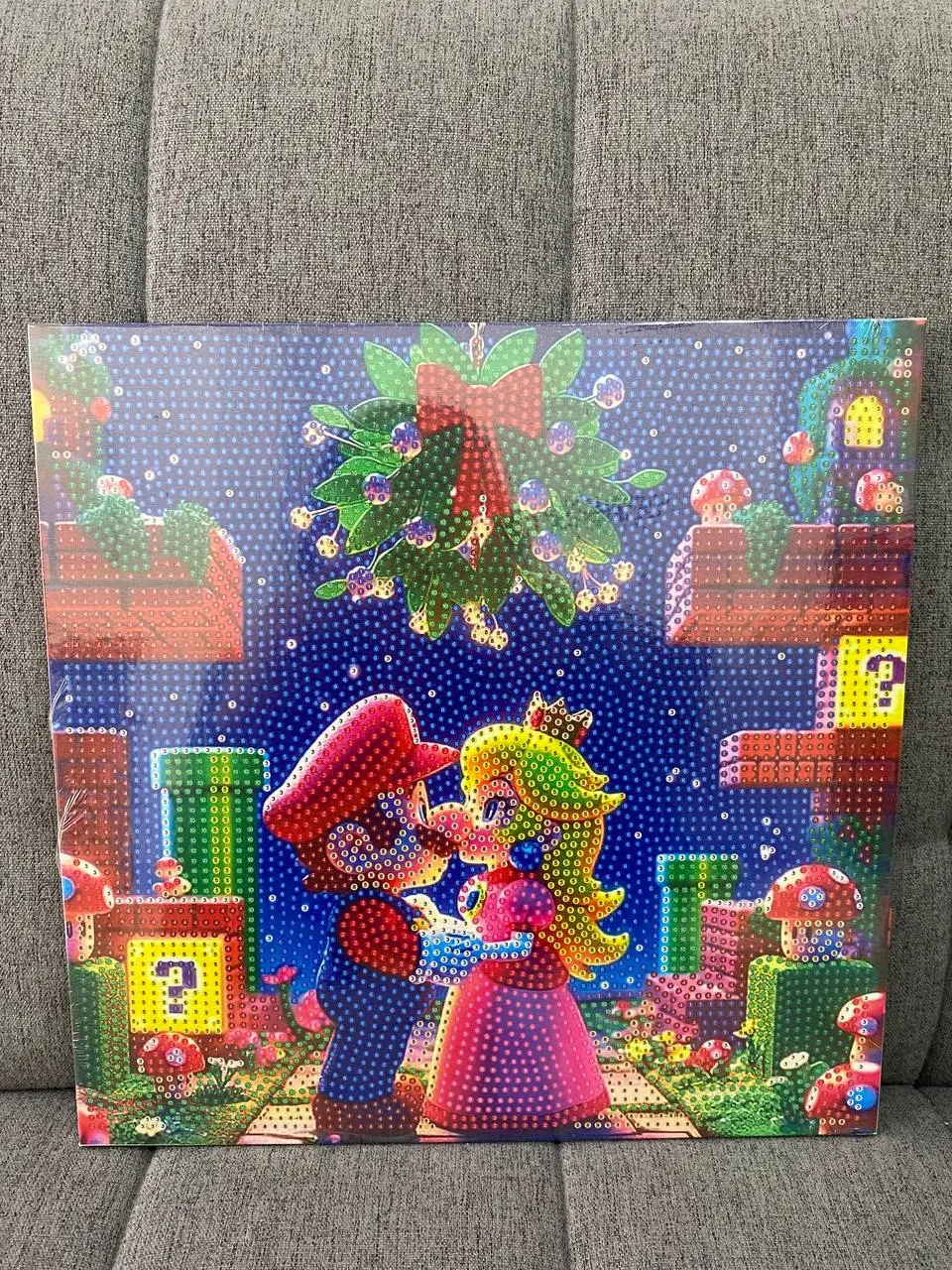 Pintura diamante 3D de Mario y Peach en escena navideña con elementos de videojuegos, con textura de cuentas brillantes y colores vibrantes
