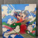 Pintura diamante 3D con diseño de Dragon Ball, mostrando a Goku y Shenron con textura de pequeñas cuentas brillantes y colores intensos.