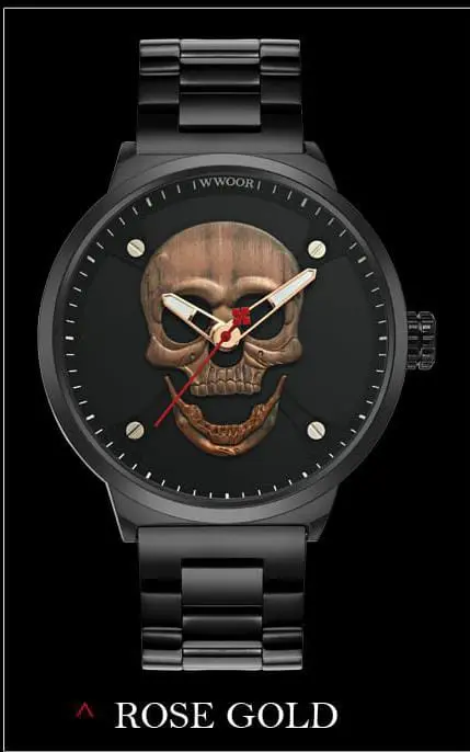 Reloj analógico negro mate con esfera de calavera en relieve metálico color oro rosa y manecillas luminosas.