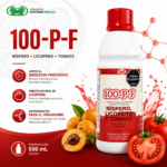 Botella blanca de 500 ml de suplemento líquido con etiqueta roja, rodeada de nísperos, tomates frescos y salpicaduras rojas.