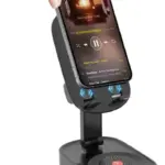 Base y parlante negro para celular con soporte ajustable, luz LED RGB en la base y conectores de inducción.
