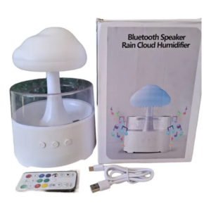 Humidificador difusor blanco de lluvia diseño hongo con base transparente, caja, control remoto infrarrojo y cable USB de carga.