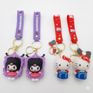 Llaveros de silicona 3D Sanrio: dos de Kuromi en marco morado con correa lila y dos de Hello Kitty con vestido azul y correa roja.