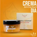 Crema facial antiedad de día en frasco ámbar con tapa negra y caja de 60 gr, sobre fondo naranja con silueta de rostro.