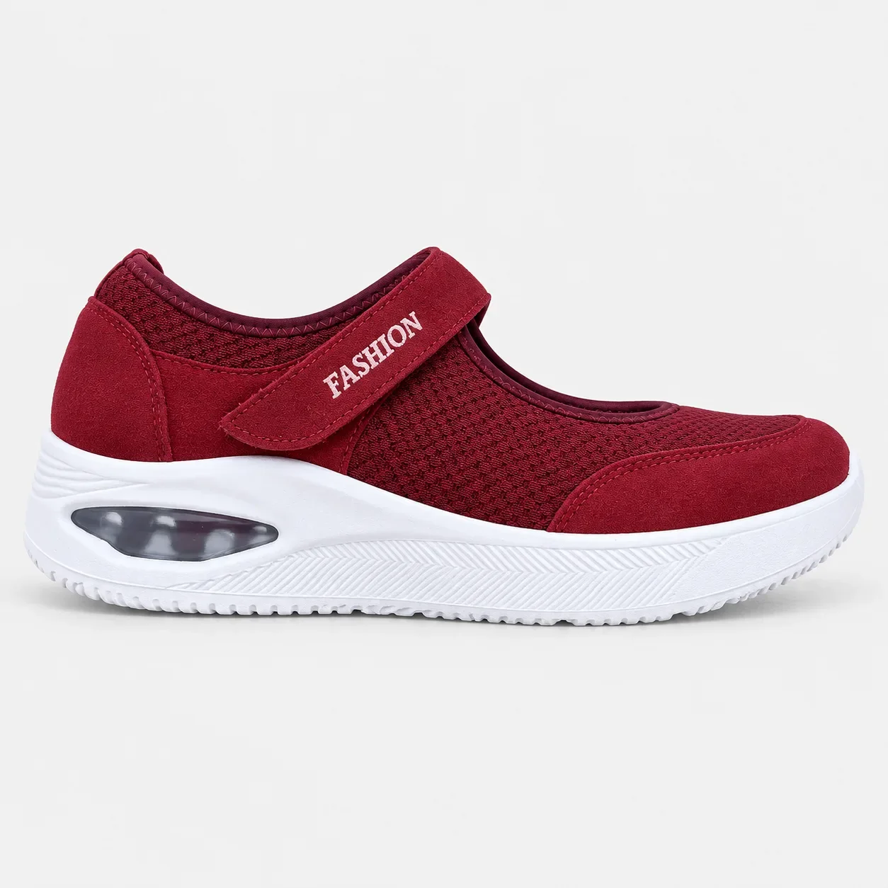 Zapatilla ortopédica Relaxconfort para mujer color vinotinto, con malla transpirable, cierre de velcro lateral y suela blanca con cámara de aire visible.