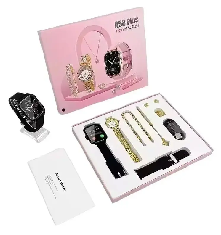 Set de regalo A58 Plus: reloj inteligente negro con correa adicional, reloj clásico dorado, pulseras, aretes, collar y cable de carga en caja rosa.
