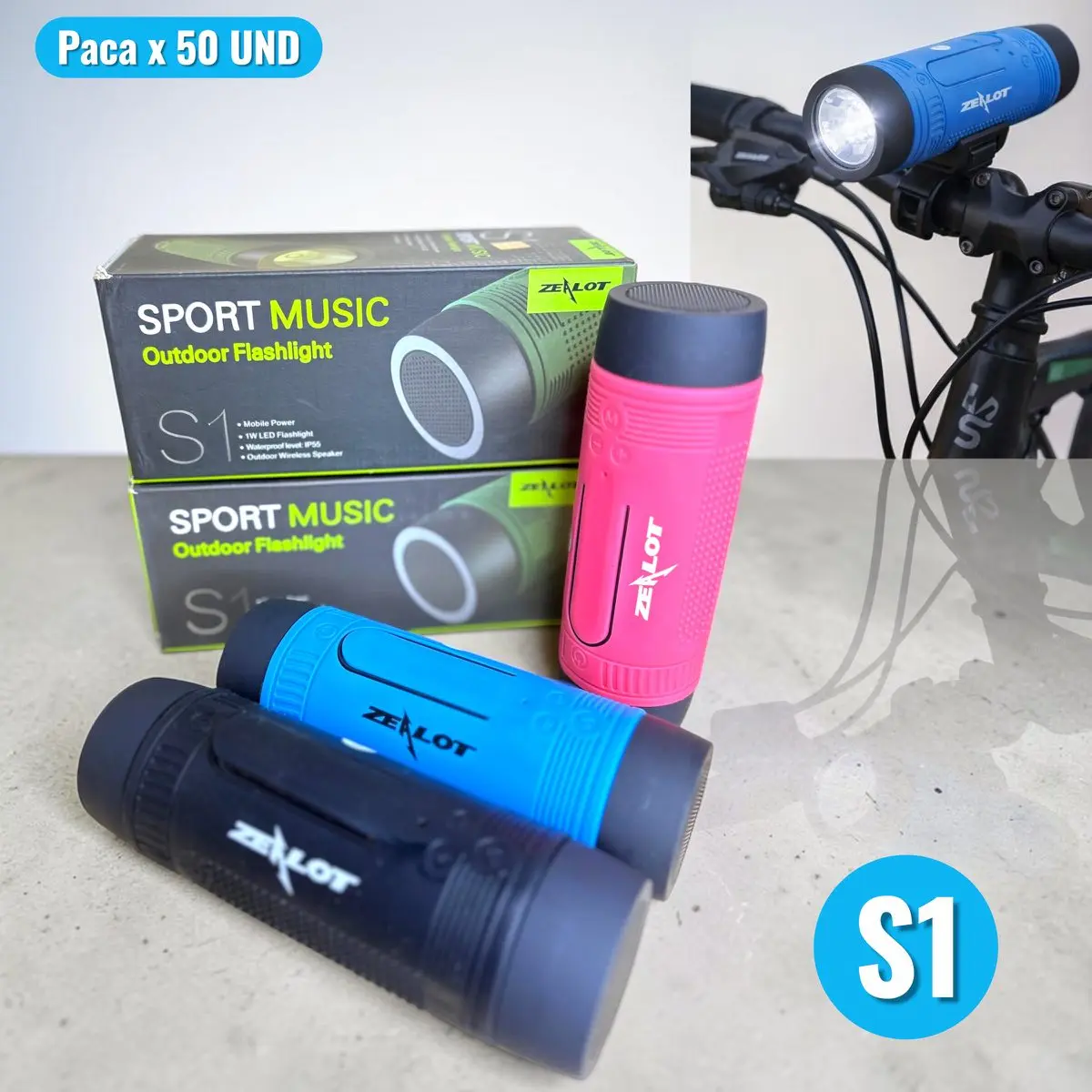 Parlante Zealot S1 con linterna LED en colores azul, rosa y negro, junto a sus cajas y un modelo montado en el manubrio de una bicicleta.