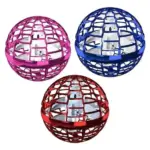 Tres esferas voladoras con estructura de rejilla en colores rosa, azul y rojo, con hélices blancas visibles en su interior.