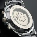 Parte posterior de reloj mecánico Winner Steel Prestige One en acero inoxidable, mostrando el movimiento automático visible y los botones laterales.