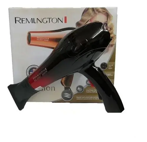 Secador de cabello profesional Remington negro con detalles en rojo, mostrado en ángulo frente a su caja de empaque original.