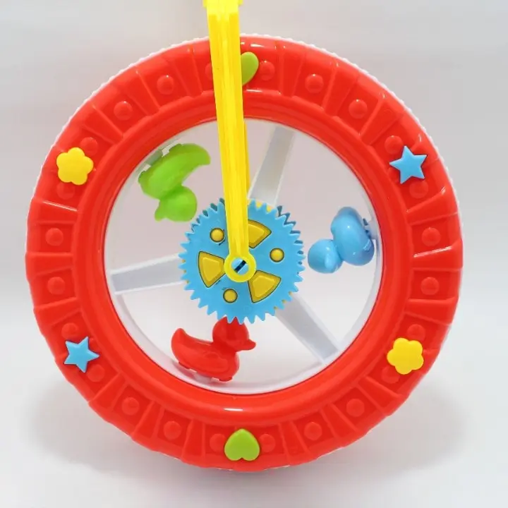 Juguete de empuje en forma de rueda roja con engranajes azules, soporte amarillo y figuras coloridas para estimular la coordinación.