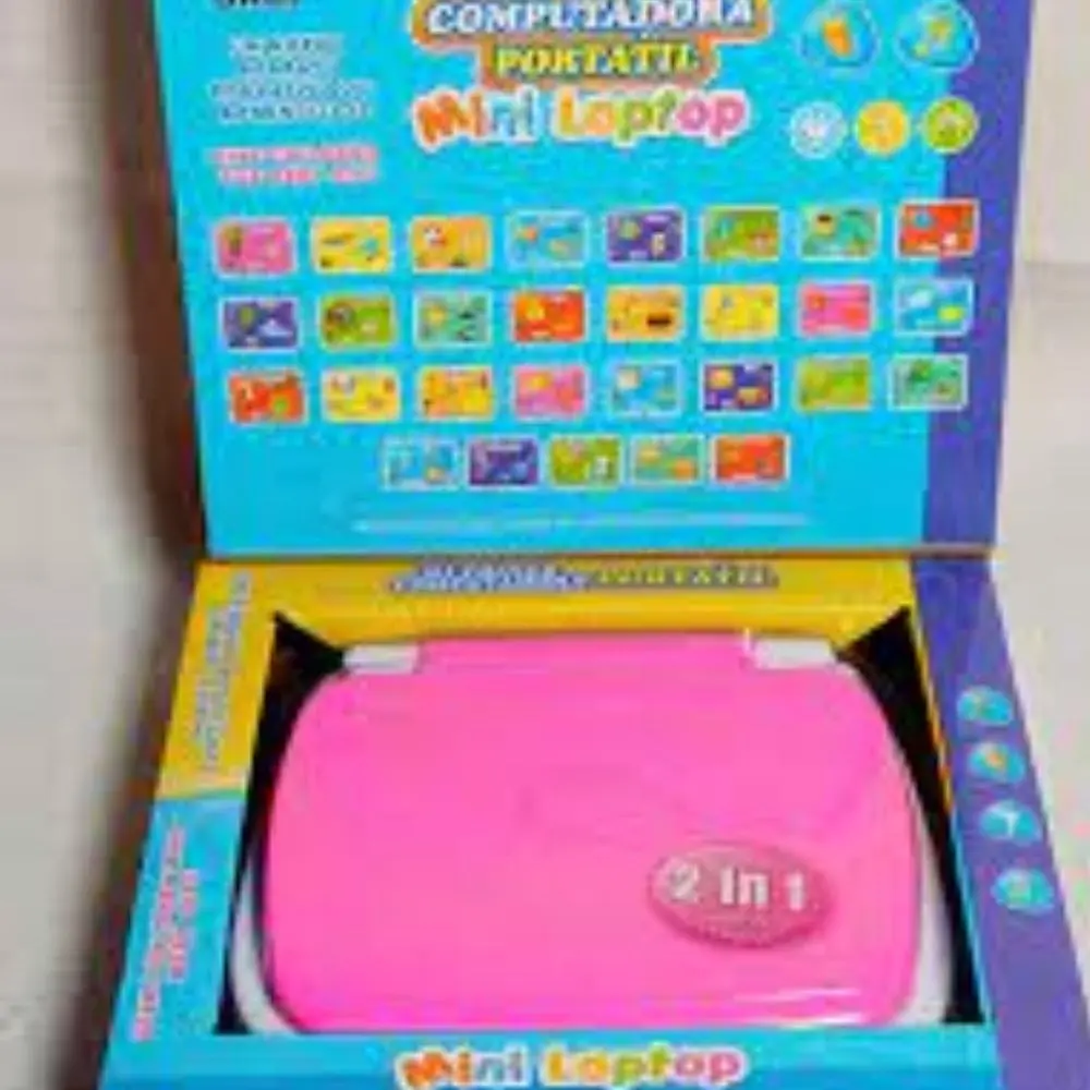 Mini laptop didáctica bilingüe infantil de color rosa, presentada en su caja original con panel de actividades educativas y diseño compacto 2 en 1.