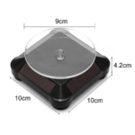 Exhibidor solar giratorio negro con plataforma circular transparente de 9 cm. Base cuadrada de 10x10 cm y 4.2 cm de altura.