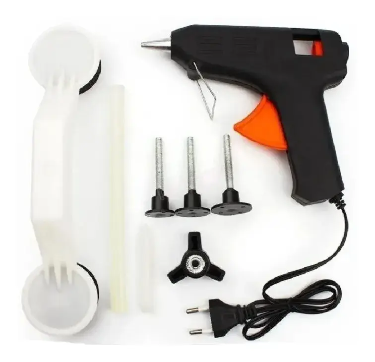 Kit saca golpes para autos con pistola de silicona negra, puente blanco, tres tornillos con base, extractor de tres patas y barras de pegamento.