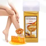 Repuesto cera depilatoria roll-on sabor miel con cabezal ancho para piernas, junto a miel y panal sobre fondo blanco.