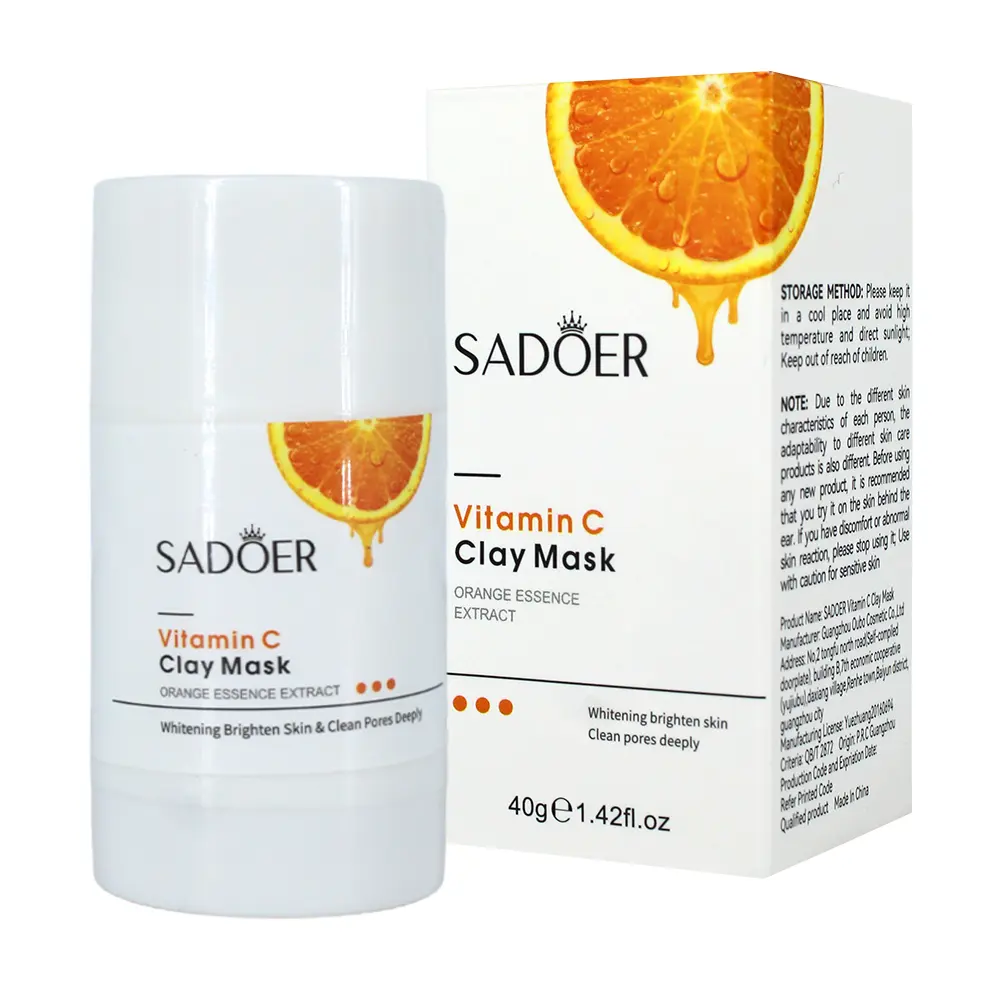 Mascarilla de arcilla en barra Sadoer de vitamina C y naranja de 40g. Envase cilíndrico blanco junto a su caja con diseño de rodaja de naranja.